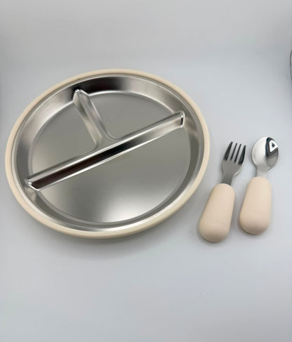 A three-compartment stainless steel divided plate with a beige rim, shown with a matching fork and spoon that have beige handles on a light gray background.